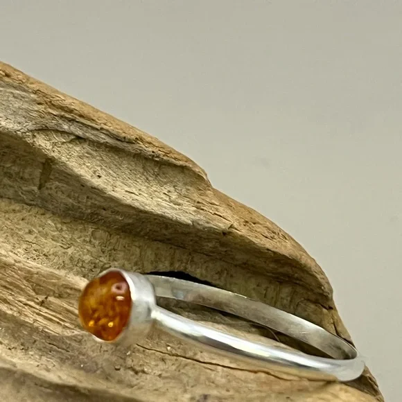 Elegant Silver and Amber Ring with Modern Minimalist Design